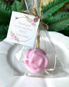 a candy bar wrapped in cellophane on a plate