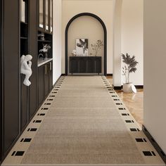 the hallway is clean and ready for guests to use it as an entrance way in this home