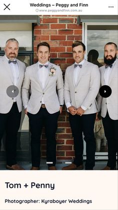 a group of men standing next to each other in front of a brick wall wearing suits and bow ties