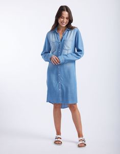 DESCRIPTION Introducing the Cleo Vintage Denim dress by White & Co. This must-have Spring wardrobe essential brings effortless style with its laid-back, vintage look. Crafted from soft, lightweight, breathable tencel denim, this shirt dress features a button-down front, twin chest pockets, and a flattering curved hem. Perfect for those days when you want to look chic without trying too hard. Pair the Cleo Vintage Dress with white sneakers for a casual day out, or dress it up with strappy sandals Relaxed Fit Chambray Denim Dress In Medium Wash, Relaxed Fit Chambray Denim Dress, Relaxed Fit Chambray Dresses In Medium Wash, Casual Washed Blue Chambray Denim Dress, Casual Washed Chambray Denim Dress, Casual Chambray Knee-length Denim Dress, Casual Chambray Denim Dress Knee-length, Relaxed Fit Chambray Dress With Pockets, Relaxed Fit Medium Wash Denim Dress For Day Out