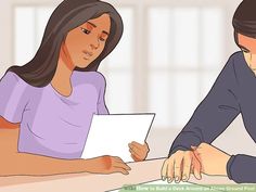 a man and woman sitting at a table with papers in front of them, looking at each other