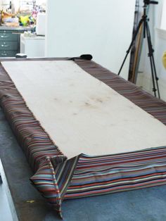 a large sheet of wood sitting on top of a table