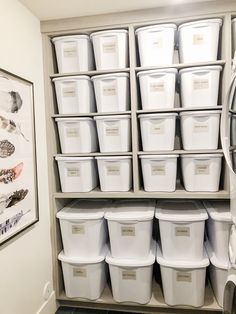 the instagram is full of white buckets and pictures on shelves in this room