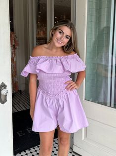 Women's Lavender Smocked Ruffle Jumpsuit Esme Ruffled Off the Shoulder Romper Looking for a playful and flirty outfit? Look no further than our Esme Ruffled Off the Shoulder Romper! This romper features a unique off-the-shoulder design and playful ruffles, perfect for a day out or a fun night out. Plus, its lightweight and breathable fabric makes it comfortable and easy to wear. Rock this romper and turn heads wherever you go! Shop more from our jumpsuits + rompers collection, here! Details Avai Purple Short Sleeve Jumpsuits And Rompers For Summer, Casual Lavender Jumpsuits And Rompers For Summer, Spring Ruffled Jumpsuits And Rompers For Daywear, Spring Daywear Jumpsuits And Rompers With Ruffles, Chic Lavender Jumpsuits And Rompers For Summer, Lavender Casual Jumpsuits And Rompers For Spring, Casual Lavender Jumpsuits And Rompers For Spring, Spring Lavender Fitted Jumpsuits And Rompers, Purple Jumpsuits And Rompers For Spring Loungewear