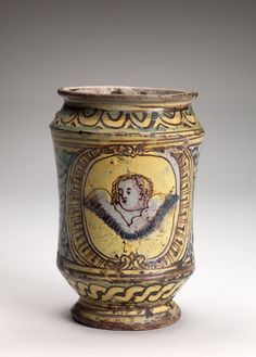 a vase with an image of a woman on it