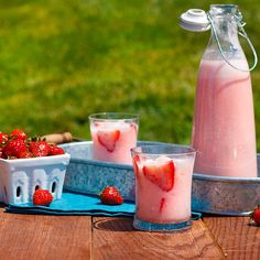 strawberry milk and yogurt on a picnic table