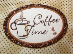 a coffee time sign on a table with polka dots and a cup of coffee in the middle