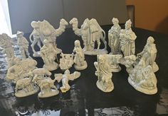 a group of figurines sitting on top of a table