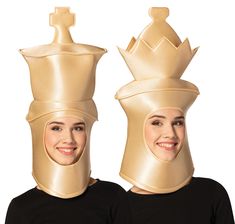 two women wearing crowns made out of gold colored material, both with faces on them