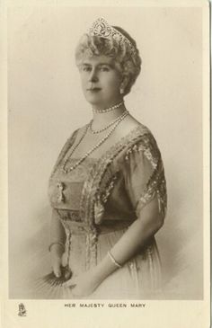 an old black and white photo of a woman wearing a tiara