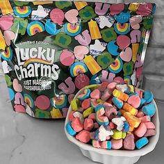 lucky charms in a bowl next to a bag of marshmallows