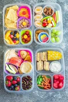 four plastic containers filled with food on top of a cement floor next to fruit and veggies