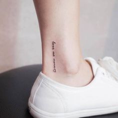 a woman's foot with a small tattoo on the ankle that reads, i love you