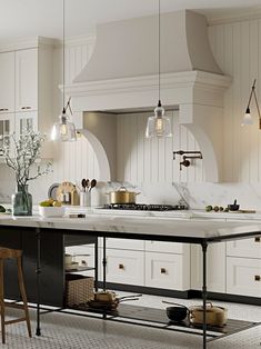 a large kitchen with white cabinets and marble counter tops, an island in the middle