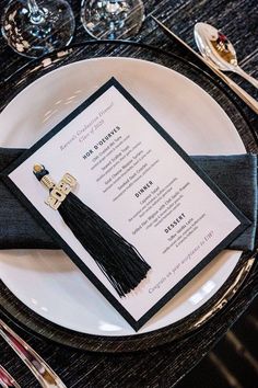 a black and white place setting with silverware