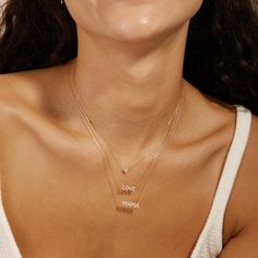 This delicate necklace with a sparkly, diamond “mama” nameplate is the perfect gift. The dainty design creates a chic vibe and is a nice addition to everyday mix and match essentials. She’ll feel sophisticated, fun and LOVED, while wearing this piece. Product Details: Material: 14K Solid Gold Chain Type: Cable Chain 0.7mm thickness Chain Length: 16 inches Extension Chain: 2 inches Pendant Dimension: 16*4mm Stone Type: Diamond Diamond Weight: 0.188carats Sophie Diamond, Dot Necklace, Mama Necklace, 14k Yellow Gold Necklace, Heart Necklace Diamond, Yellow Gold Necklace, Solid Gold Chains, Delicate Chain, Solid Gold Jewelry