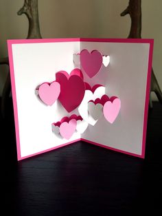 a card with hearts cut out of it