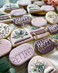 decorated cookies are arranged on a table with flowers and greenery in the background that says happy retirement