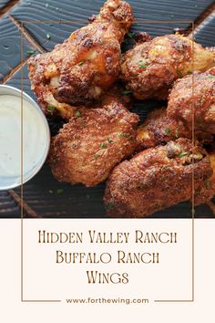 chicken wings with ranch dressing on top and the words hidden valley ranch buffalo ranch wings