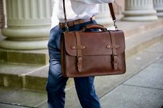 This handcrafted men's leather briefcase was inspired by vintage lawyer briefcases from decades ago. Made of full grain leather that's rich in character and solid antique brass hardware, this bag is built to last. Office Satchel With Brass Hardware, Classic Cognac Satchel With Leather Handles, Travel Satchel Briefcase With Brass Hardware, Business Bags With Brass Hardware In Cognac, Cognac Business Bag With Brass Hardware, Luxury Satchel Briefcase With Brass Hardware, Timeless Brown Satchel With Brass Hardware, Classic Leather Bag With Brass Hardware, Formal Leather Satchel With Brass Hardware