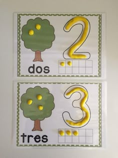 two posters with numbers and trees on them