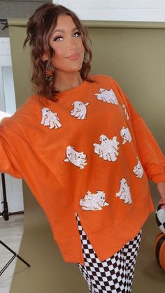 Upgrade your spooky season look with our BOO Thing Oversized Halloween Ghost Sweatshirt - This terry cloth oversized sweatshirt will keep you warm and stylish all fall long! Featuring sequin ghosts throughout this sweatshirt created the perfect spooky season look!! Sequin ghost sweatshirt Orange Oversized halloween sweatshirt Spooky season sweatshirt Terry cloth material Measurements: (Approximate. Measured lying flat.**Oversized fit. Size down for a less oversized fit. ) S- (4/6) Length 26 1/4" M- (8/10) Length 27" L- (12/14) Length 27 1/2" Model Specs: Emily is wearing a size small in the photo.How will this item fit you? Check out our MODEL SPECS (Typical Sizing - Karli: S-Size 5/26 - 5ft 2in, Emily: S-Size 3/25 - 5ft 5in, Syd: L/XL- Size 15/ - 5ft 8in)Need help with sizing? No problem! Orange Gifts, Style Wide Leg Jeans, Bride Top, Ghost Sweatshirt, Everyday Chic, Exclusive Dress, Ghost Halloween, Cloth Material, Dresses By Length