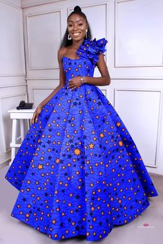 Lope royal blue dress is a ball dress with one sleeve and zip at the back for perfect fit Ankara dress is a type of dress that is made from Ankara fabric, which is a colorful cotton fabric with various patterns and designs. Ankara fabric is also known as African wax print, Dutch wax, or African print1. Ankara dress is popular among African women, especially in Nigeria, Ghana, and other West African countries. Ankara dress can be worn for different occasions, such as weddings, parties, casual outings, and cultural events. Ankara dress can be styled in various ways, such as short dresses, long dresses, maxi dresses, midi dresses, skater dresses, kimono dresses, and more. Ankara dress can also be accessorized with headwraps, belts, jewelry, and shoes to create a unique and fashionable look An Long Kitenge Dress Designs Unique, African Attire Dresses Classy Beautiful, African Attire Dresses Classy, Orange African Dress, Wedding Color Royal Blue, Kitenge Dress Designs Unique, Kitenge Dress Designs, African Prom Dresses Ankara, Welcoming Party