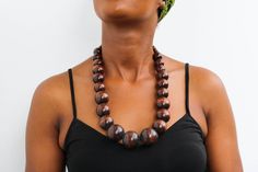 African wooden necklace, Statement Necklace, Wooden Bead Jewelry, Beaded women jewelry, Tribal necklace, Christmas gift for her, Mom's gift An elegant necklace that can compliments any outfit. Handmade by the Maasai women in Kenya using wooden beads. One size fits all. Color: Brown Necklace length: 20 inches 3-5 days delivery via DHL Express.  Pay shipping fee for the first item only and additional items ship for FREE. To view more wooden necklaces in our shop, kindly click here:  https://www.etsy.com/shop/NkoroiCrafts?ref=shop-header-name&listing_id=1295099274&section_id=43662872 Gift Wooden Beaded Necklaces, Gift Wooden Beads Necklace, Gift Beaded Necklaces With Wooden Beads, Wooden Large Beads Jewelry As Gift, Wooden Jewelry With Large Round Beads, Wooden Round Beads Necklace As Gift, Wooden Brown Beaded Necklace Gift, Mahogany Wooden Beads Jewelry For Gifts, Wooden Round Bead Necklaces As Gift