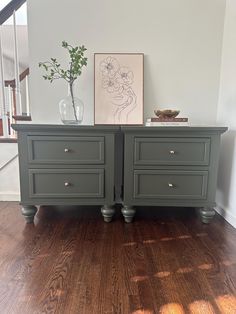 two gray dressers with drawers on top of them