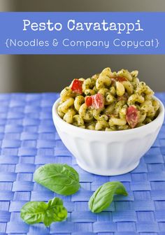 pesto cavatapi noodles and company copycatch on a blue place mat