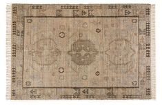 an antique rug with fringes on the edges and a design in grey, beige and white