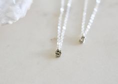 "These cute tiny block letter charms are made of solid sterling silver hanging on a sterling silver chain. So pretty and simple perfect for everyday wear! All items come in a cute little package, ready for gift giving. d e t a i l s * Sterling silver chain + clasp * Sterling silver charm * Charm approx. 8mm h o w * t o * o r d e r 1. please select options from the dropdown menu 2. add to cart and proceed to checkout g i f t i n g If you're sending an order directly to a loved one, I can add a sw Simple Silver Initials Charm Necklace, Simple Silver Charm Necklaces With Initials, Silver Simple Charm Necklaces With Initials, Silver Hypoallergenic Charm Necklace With Initial Pendant, Silver Hypoallergenic Initial Pendant Charm Necklace, Silver Hypoallergenic Initial Pendant Charm Necklaces, Hypoallergenic Silver Charm Necklace With Initial Pendant, Hypoallergenic Silver Initial Pendant Charm Necklaces, Silver Initial Necklace With Letter Beads For Anniversary