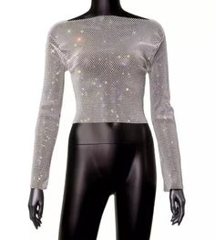 Rhinestone mesh long sleeve top.The fabric of this top is very stretchy. One size top (goes between XS, S, M, L, XL) Spring Fitted Mesh Top With Rhinestones, Trendy Evening Crop Top With Long Sleeves, Trendy Long Sleeve Evening Crop Top, Fitted Mesh Top With Rhinestones For Spring, Trendy Long Sleeve Crop Top For Evening, Fitted Rhinestone Mesh Top For Spring, Long Sleeve Stretch Tops For Club, Stretch Long Sleeve Club Tops, Trendy Evening Mesh Top With Mesh Sleeves