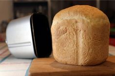 a loaf of bread sitting on top of a cutting board