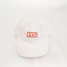 1HP CAP Embroidered 1HP logo on the front.Cap is unstructured white daddy cap style.Back strap is adjustable. Backpacks, White