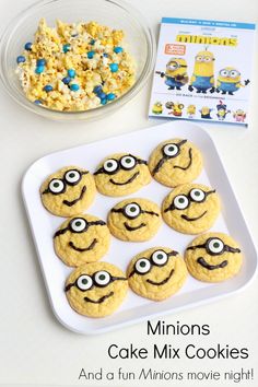 minion cake mix cookies are on a plate with cereal and a bowl of popcorn