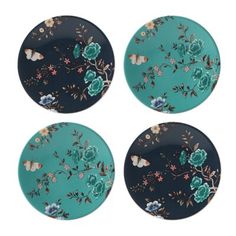 three plates with blue flowers and butterflies on them