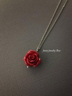 Dark red rose necklace. Red rose is on a delicate but sturdy 18'' stainless steel chain with lobster clasp. If you choose to add initials, please leave the initials in order left to right in the note to sellers box during checkout. *Necklace is available with 1,2 and 3 leaves *15mm Resin rose *Silver plated brass leaves *Stainless steel chain *Handmade with love <3 Like Jmesjewelrybox on Facebook for updates on new jewelry, upcoming sales and giveaways! Plus Facebook fans save 5% :D Find the Rose Nickel Free Jewelry For Gift, Rose-colored Nickel-free Jewelry For Gifts, Rose Nickel-free Jewelry For Gift, Dainty Rose Jewelry For Valentine's Day, Valentine's Day Flower Pendant Jewelry With Rose Design, Valentine's Day Rose Design Flower Pendant Jewelry, Rose Red Jewelry With Rose Design For Gift, Rose Red Roses Jewelry For Valentine's Day, Rose Sterling Silver Jewelry For Valentine's Day