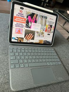 an open laptop computer sitting on top of a table