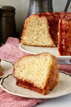 two slices of pound cake on plates with one slice cut out and the other half eaten