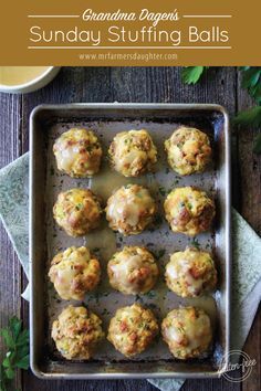 some meatballs are sitting on a baking sheet