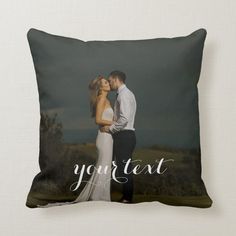 a couple kissing on their wedding day pillow