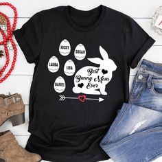 a t - shirt with the words best bunny mom ever and an arrow on it