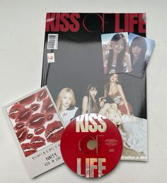 the cd cover for kiss life is displayed next to it's disc and album