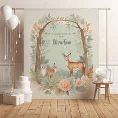 a baby shower is decorated with deer and flowers