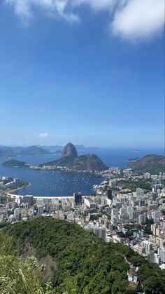 a view of the city and water from top of a hill in rio, brazil