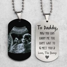 two dog tags with the words to daddy, now you can carry me too can't wait to meet you love, the bump