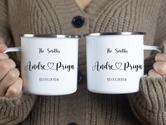 two people holding coffee mugs with names on them