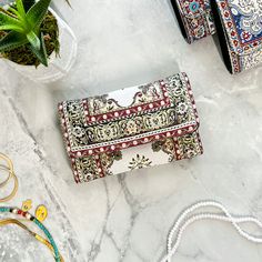 "These boho wallets are made from rug design fabric and vegan leather.  Featuring a stunning bohemian rug design with bold colors and intricate patterns, this wallet is the perfect accessory for any woman who loves to stand out from the crowd. It makes an excellent Mother's Day gift, Christmas gift, anniversary gift, or just because gift for the special woman in your life. Made of high-quality, durable materials, this wallet is built to last and will be a cherished gift for years to come. The wa Bohemian Brown Rectangular Wallet, Bohemian Multicolor Wallets As Gifts, Bohemian Handmade Wallets As Gift, Bohemian Multicolor Wallets For Daily Use, Handmade Bohemian Wallet As Gift, Handmade Bohemian Wallets For Gift, Bohemian Wallet With Card Slots For Daily Use, Bohemian Rectangular Wallet For Festivals, Bohemian Style Rectangular Wallets For Gifts