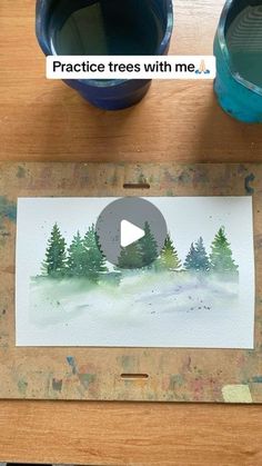 an image of some watercolors and paint on a table with the words practice trees with me